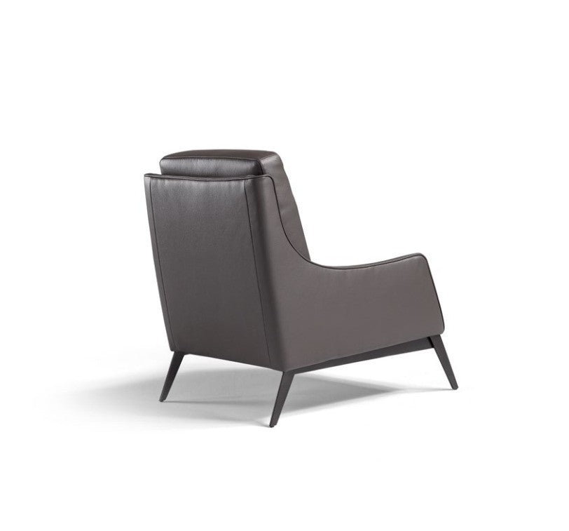 Rear three-quarter view of the Alicudi armchair in dark brown leather with wooden base on a white background