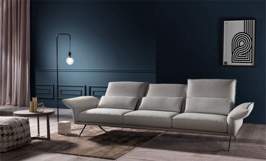 Capitolo 3-seater sofa in light grey upholstery in a modern living room with a blue accent wall
