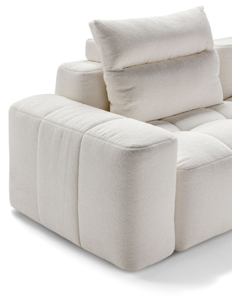 Close-up detail of the Quadra sofa armrest, seat and back cushion stitching