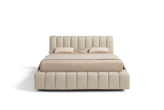 Front view of the Scervino storage bed showing the vertical channel-tufted headboard and bed frame in cream leather
