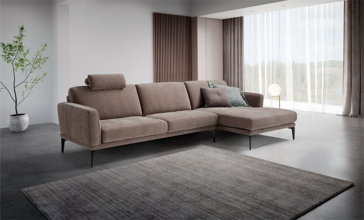 Agi sectional sofa with chaise longue and headrest in a modern living room setting