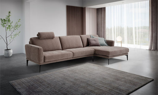 Agi sectional sofa with chaise longue and headrest in a modern living room setting