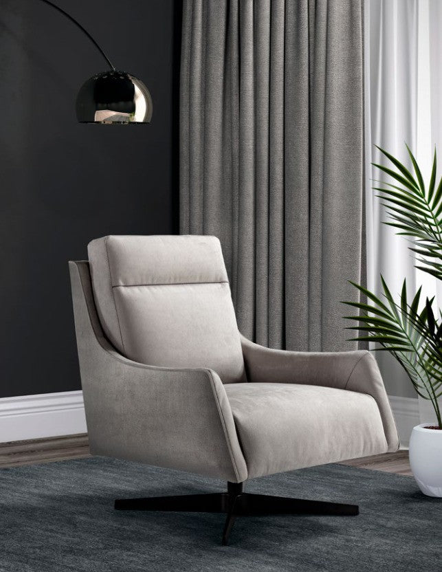 Alicudi swivel armchair in light grey fabric on a four-star base, three-quarter view against a dark wall