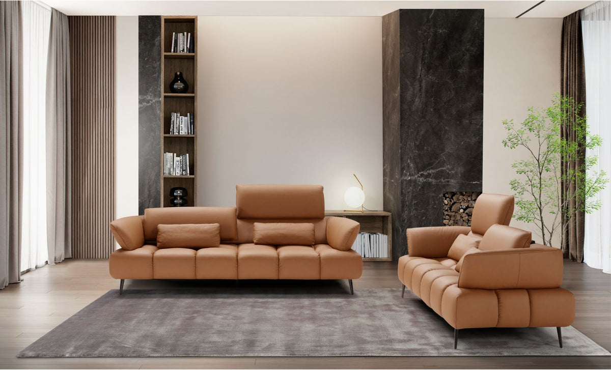 Ambra three-seater and two-seater sofas in tan leather with adjustable backrests in a contemporary living room