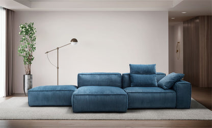 Blue corduroy-style modular sectional sofa with an open chaise end in a contemporary living room