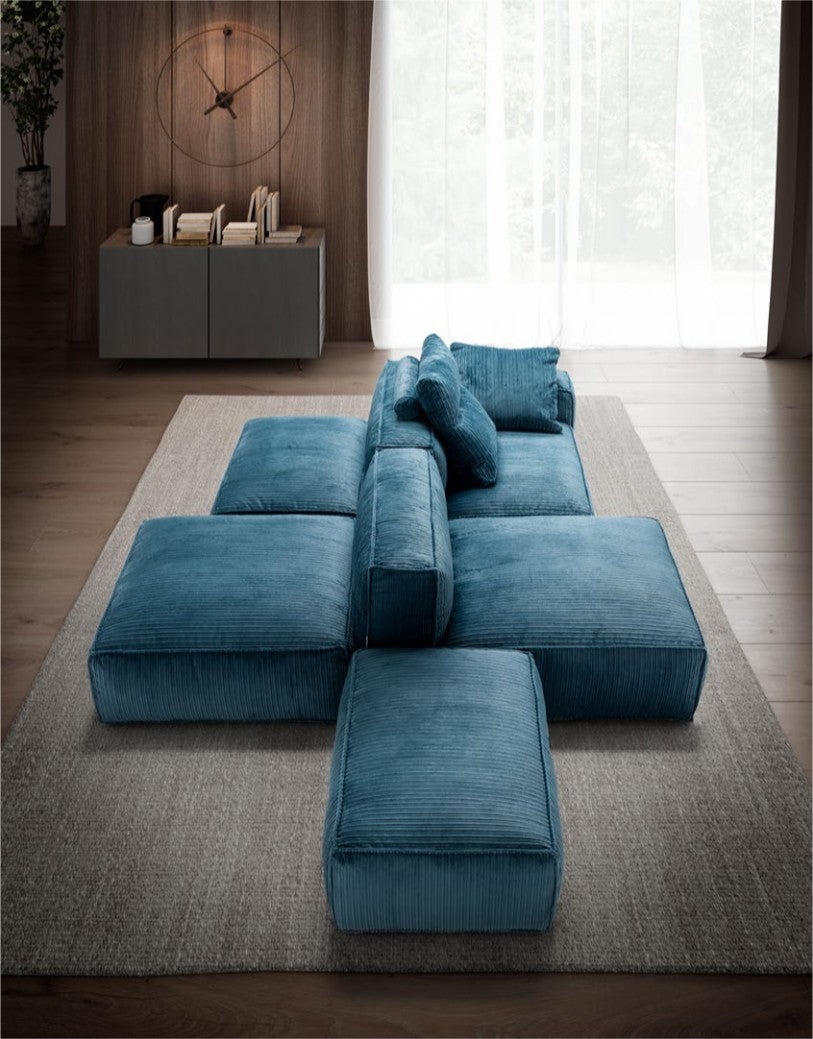 Overhead view of a blue modular sectional sofa with cross-shaped layout and matching ottomans
