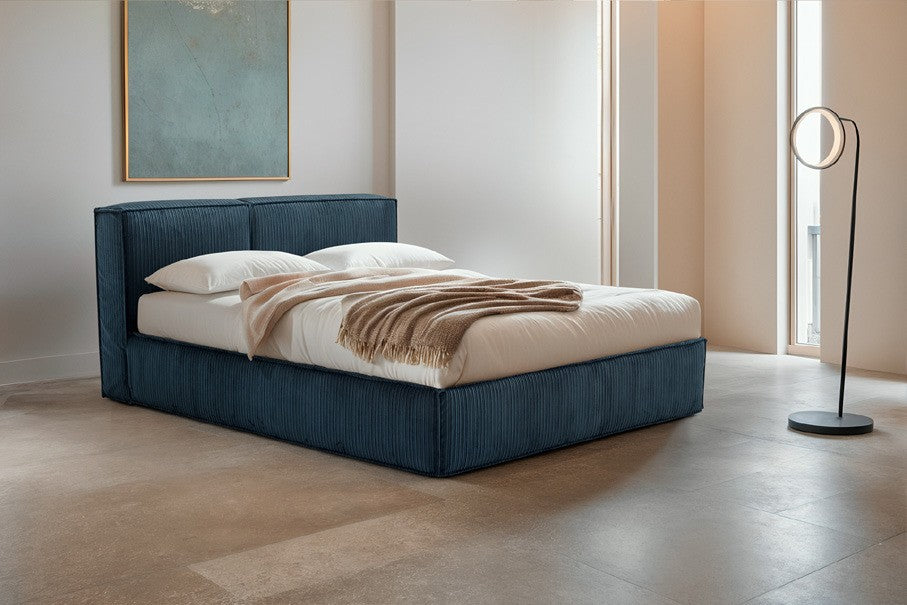 Astor storage bed in blue ribbed fabric with two-panel headboard in a bright contemporary bedroom