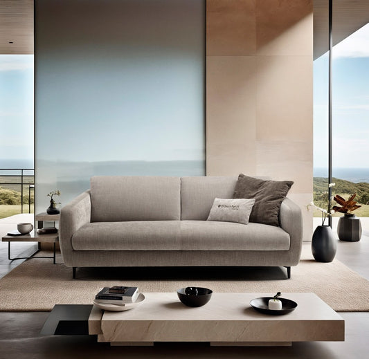 Baca sofa bed in light grey fabric with slender black metal legs in a contemporary living room with floor-to-ceiling windows