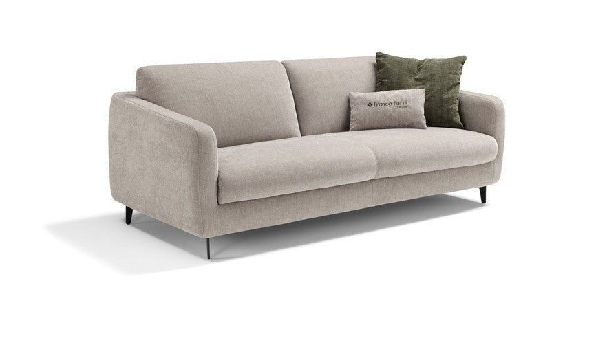 Baca sofa bed in light grey fabric with tapered arms and slender metal legs, three-quarter view on white background