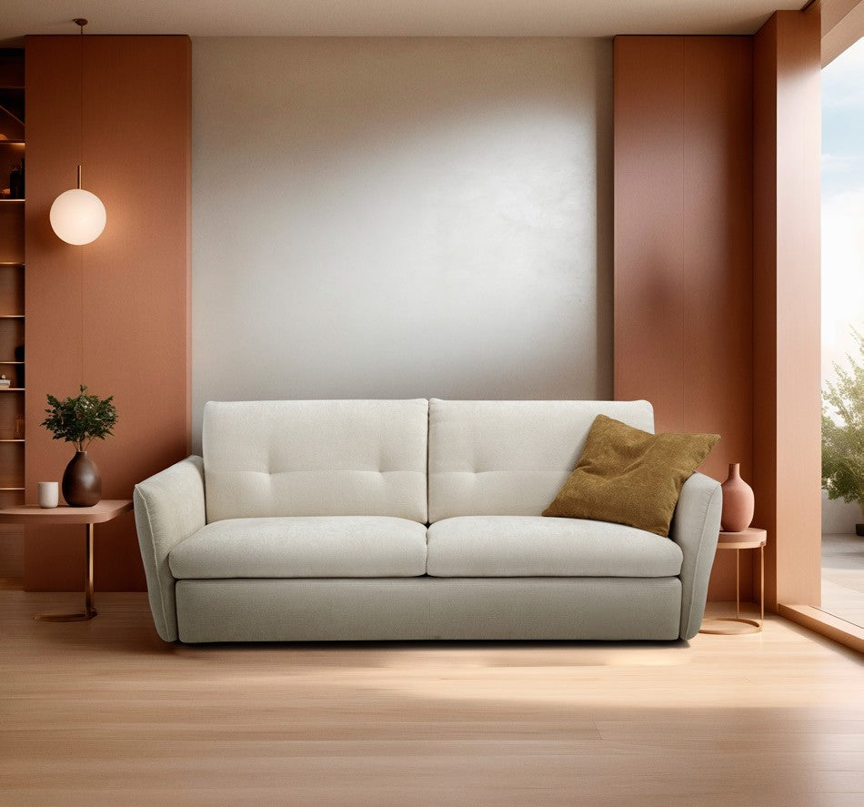 Bar sofa bed in cream fabric with quilted backrest and sloping armrests in a warm terracotta living room