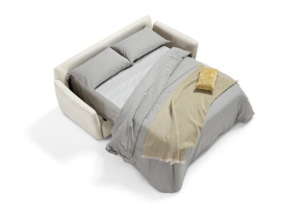 Bar sofa bed opened into a bed with grey bedding and a beige throw, seen from above