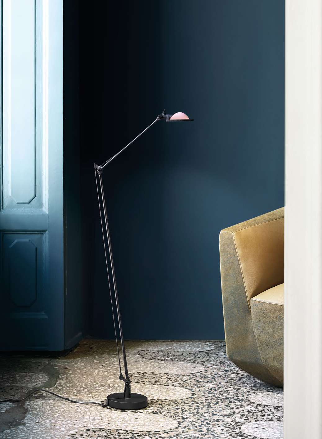 Luceplan Berenice Floor Lamp beside an armchair