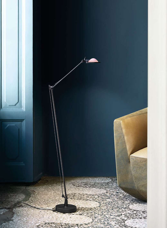 Luceplan Berenice Floor Lamp beside an armchair