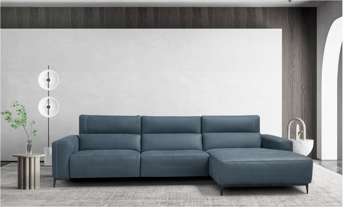 Bertè sectional sofa in blue leather with chaise longue and slim metal legs in a contemporary living room