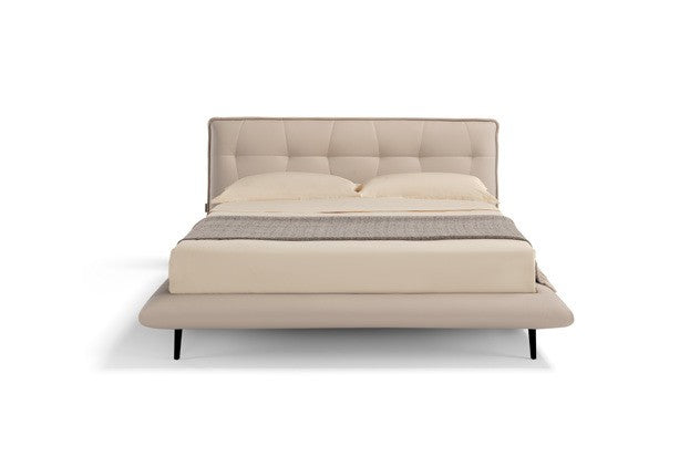 Borg Bed front view showing the tufted curved headboard, rounded bed frame and black metal legs, on white background