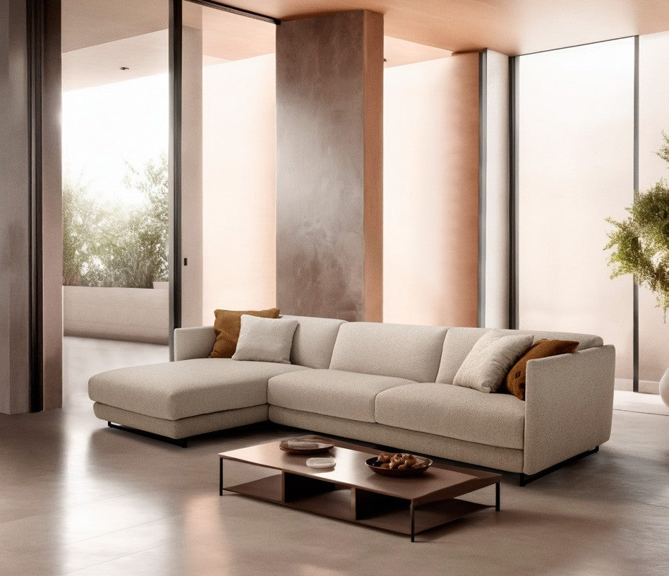Costa sofa bed sectional with chaise longue in cream fabric in a warm contemporary living room