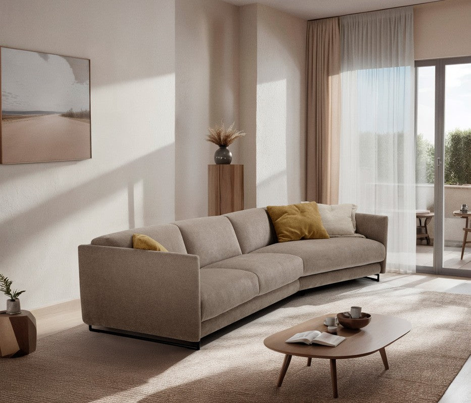 Costa sofa bed with angled element in taupe fabric in a sunlit living room