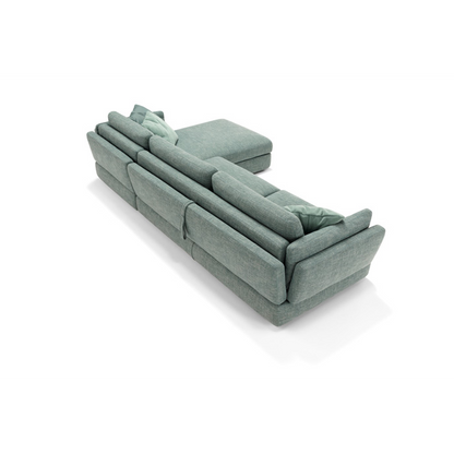 Dambo sectional sofa bed in sage green fabric, rear view showing the shaped armrests and back cushions
