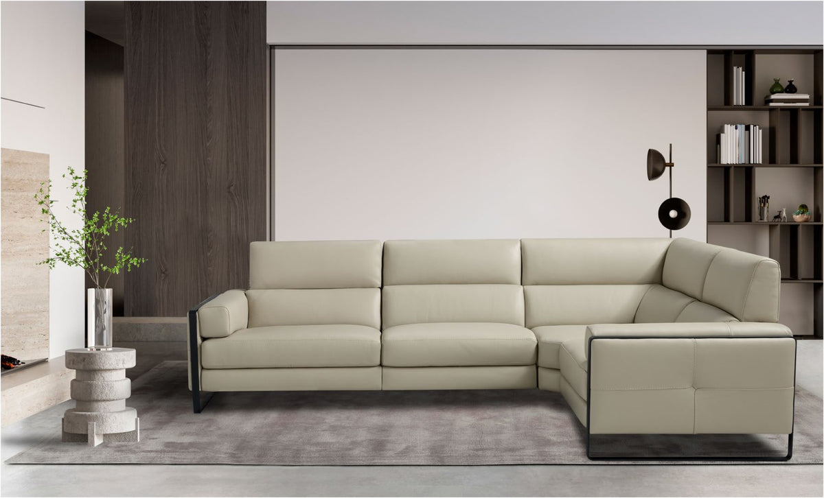Daunia corner sectional sofa in light grey leather with black metal-framed armrests in a contemporary living room