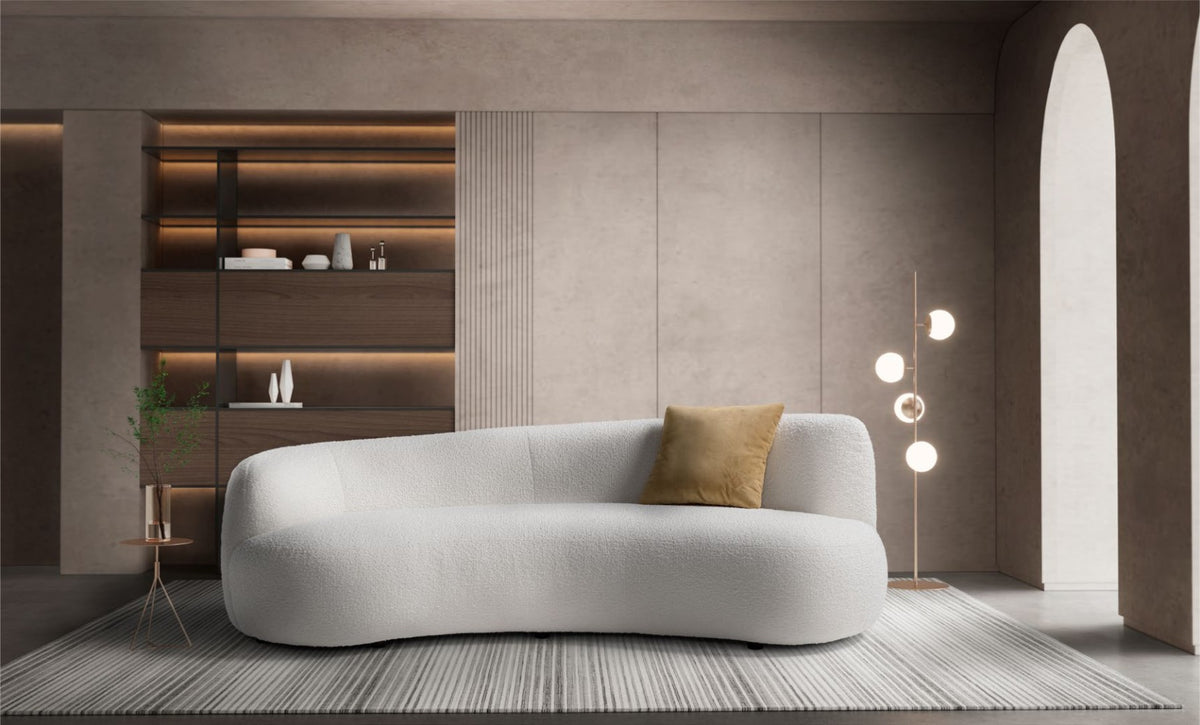 Elisa curved sectional sofa in ivory bouclé fabric styled in a modern living room