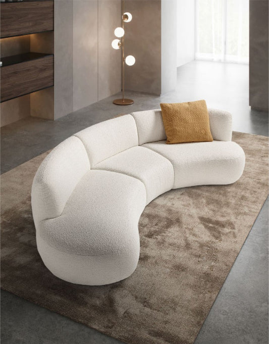 Elisa modular sofa with an ochre accent pillow in a contemporary lounge setting