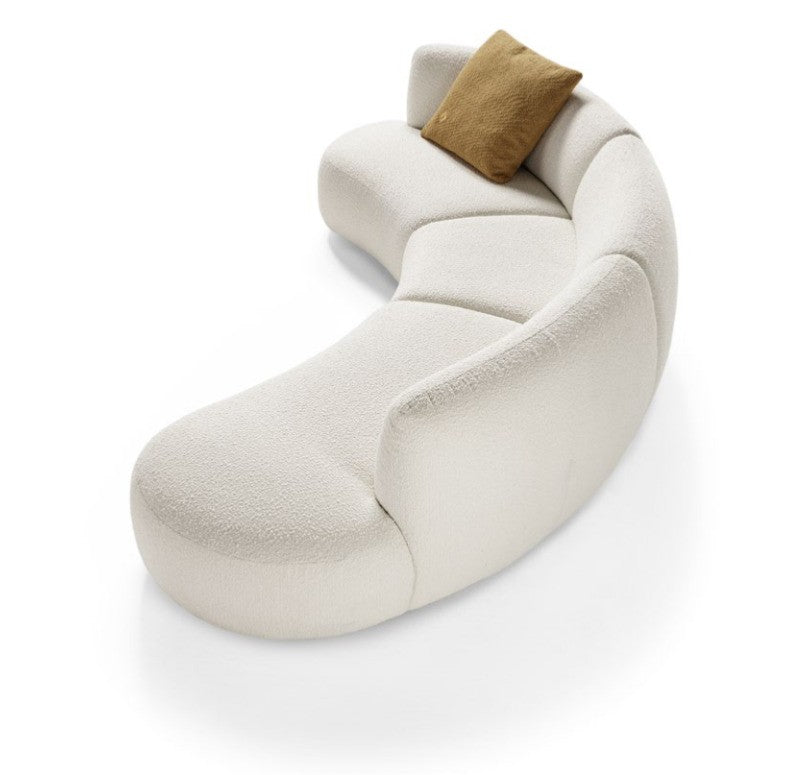 Cutout angled view of the Elisa curved sectional sofa in ivory bouclé