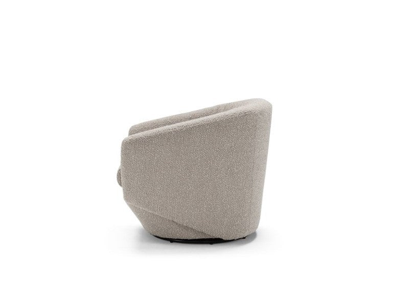 Fracco armchair side view on white background showing the enveloping backrest and round metal base