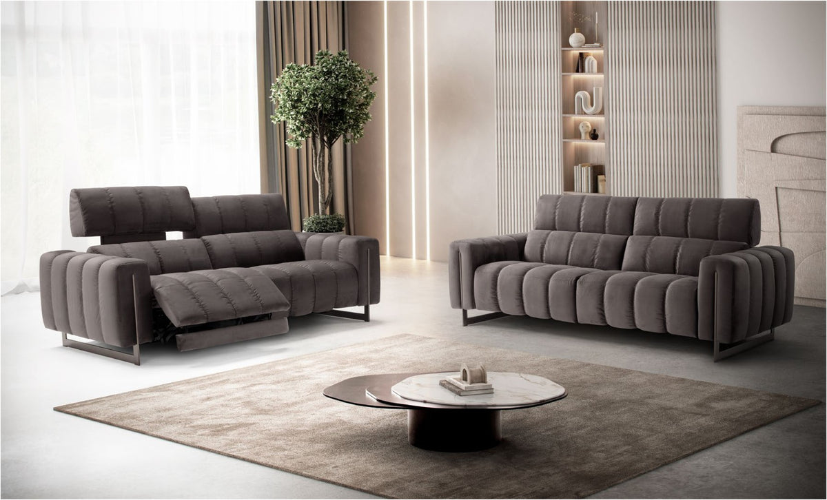 Genesi reclining sofas in grey velvet in a contemporary living room, one with the seat extended and headrest raised