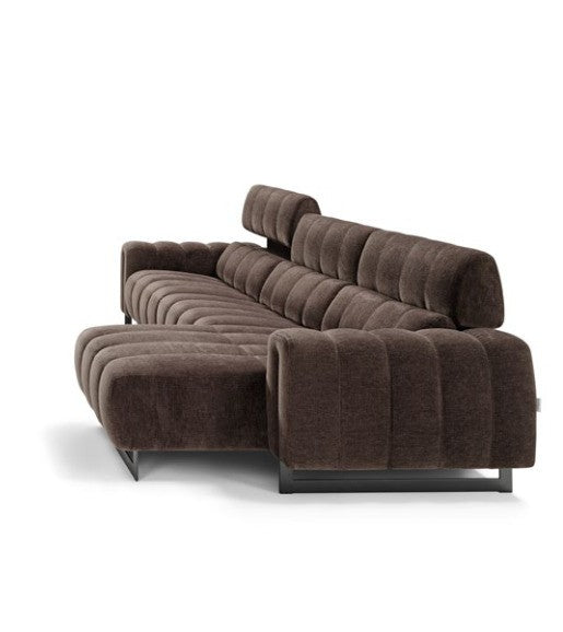 Side view of the Genesi sectional sofa with chaise longue showing the channel stitching and metal frame feet