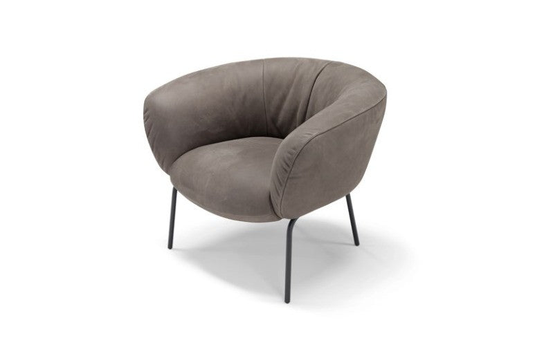 Jill armchair in taupe leather with a curved shell back and slim black metal legs, three-quarter view