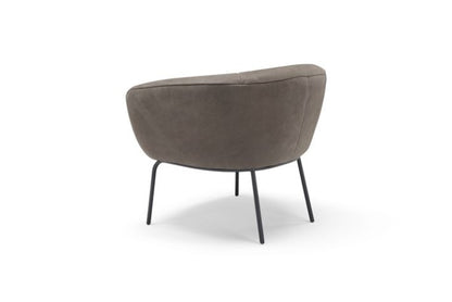 Rear view of the Jill armchair in taupe leather showing the wraparound shell and metal legs