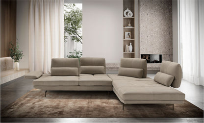 Le Bambole sectional sofa in taupe upholstery in a contemporary living room with fireplace, left armrest tilted flat and adjustable backrests with lumbar cushions