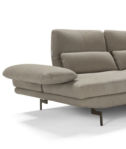 Detail of Le Bambole sofa showing the tilting armrest cushion, backrest with lumbar cushion, visible stitching and metal feet