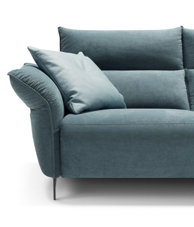 Close-up of the Levi Light soft adjustable armrest, cushions and slim metal leg in teal fabric