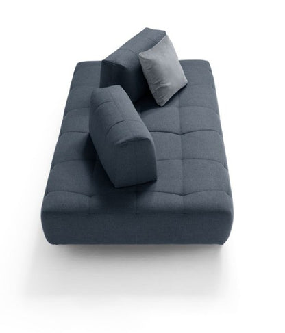 Marvel seat element in blue fabric with quilted boxspring base and freestanding backrest cushions, seen from above on a white background