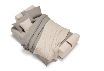 Memo sofa bed opened into a bed with bedding, top-down view