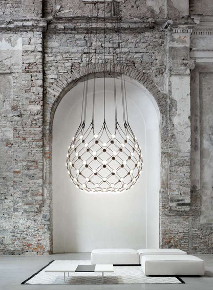 Luceplan Mesh suspension lamp, large scale, in an archway living room