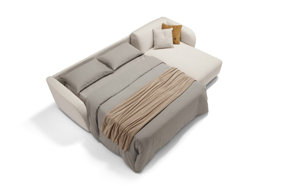 Minerva sofa bed with chaise longue in cream fabric opened into a bed, seen from above