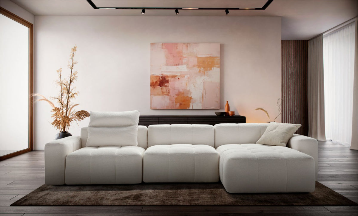 Quadra modular sectional sofa in cream boucle fabric styled in a contemporary living room