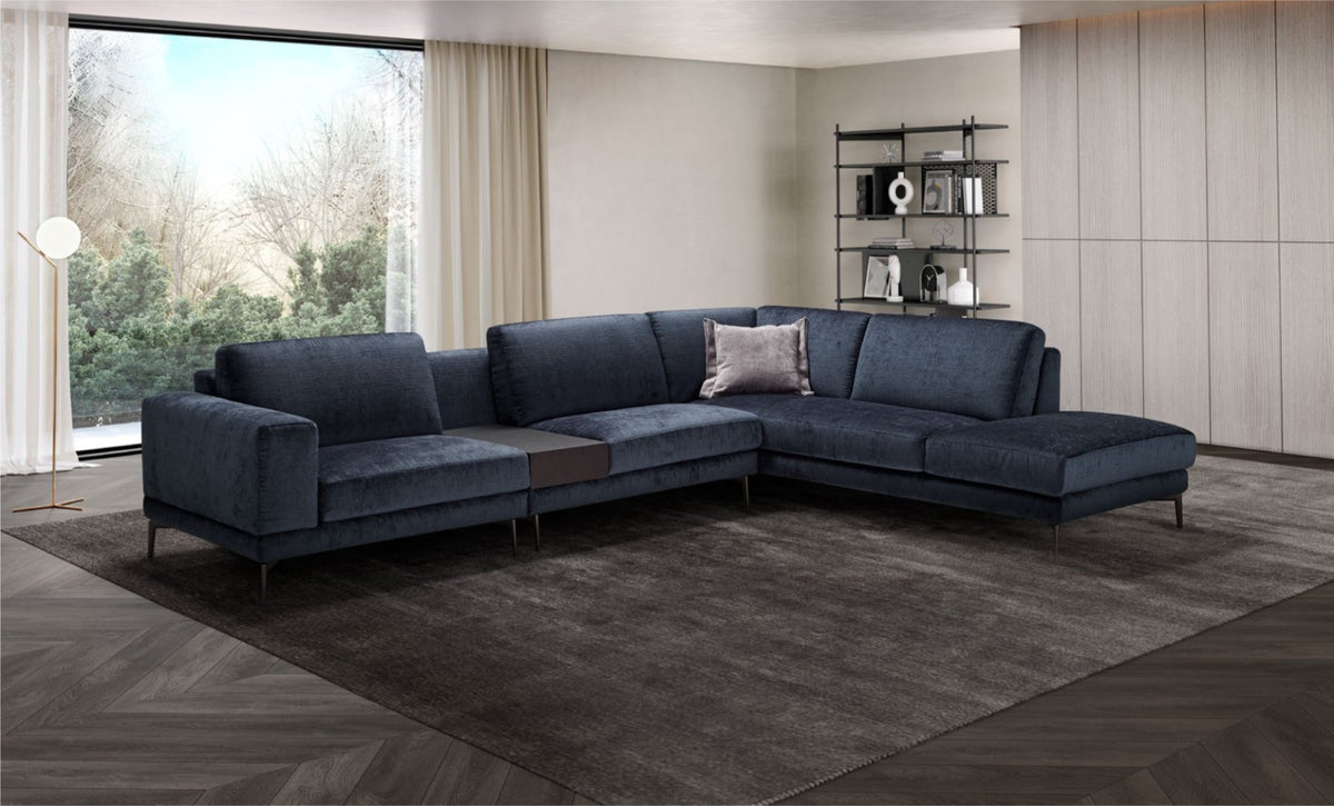 Navy blue fabric corner sectional sofa with integrated coffee table in a modern living room