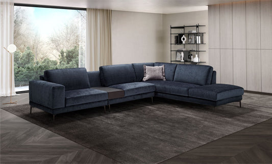 Navy blue fabric corner sectional sofa with integrated coffee table in a modern living room