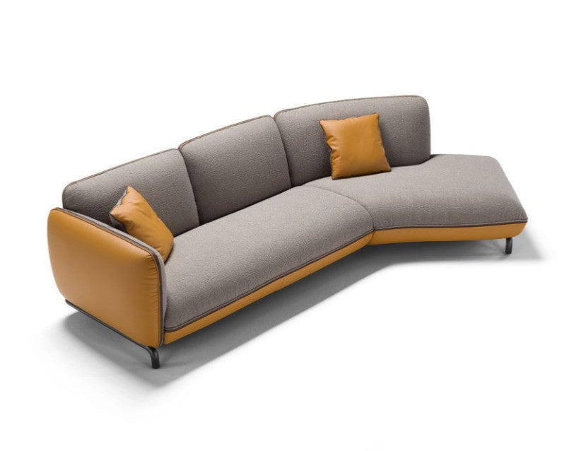 Rock corner sectional sofa in grey fabric and mustard leather, three-quarter front view on a white background