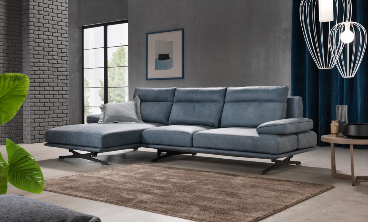 Blue leather corner sectional sofa with chaise in a modern living room