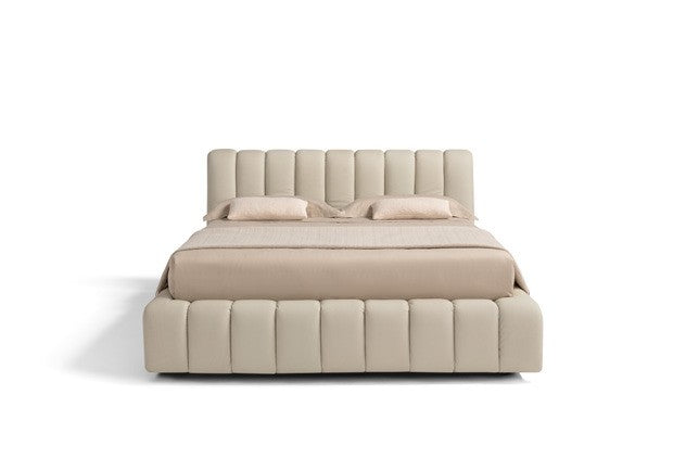 Front view of the Scervino storage bed showing the vertical channel-tufted headboard and bed frame in cream leather