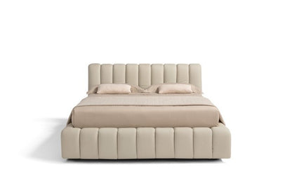 Front view of the Scervino storage bed showing the vertical channel-tufted headboard and bed frame in cream leather