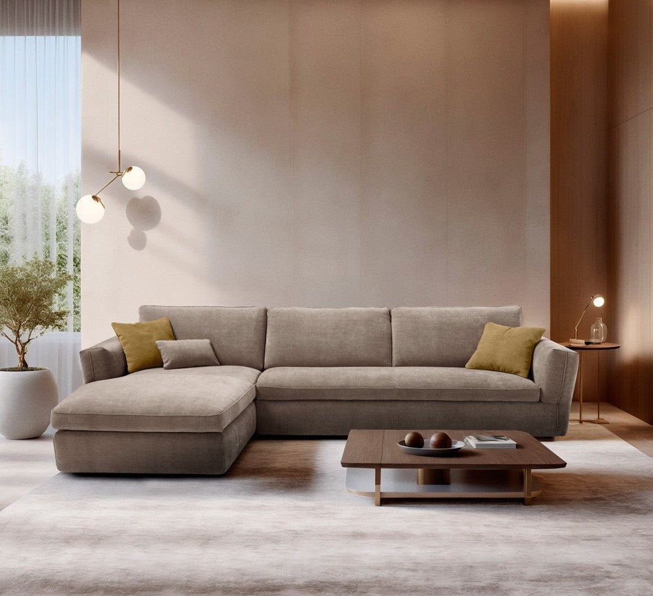Siria sectional sofa bed with chaise longue in taupe fabric, styled with mustard cushions in a wood-panelled living room