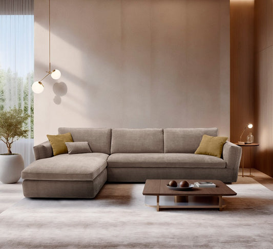 Siria sectional sofa bed with chaise longue in taupe fabric, styled with mustard cushions in a wood-panelled living room