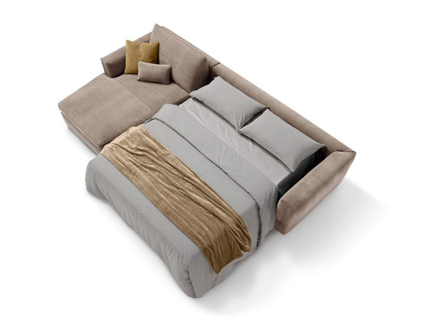 Siria sofa bed opened into a double bed with grey bedding, chaise longue element alongside, top view