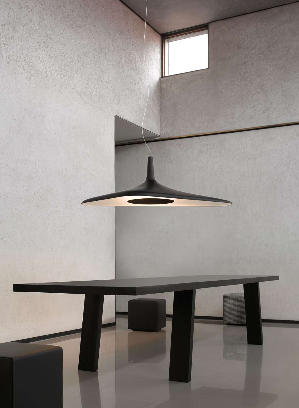Luceplan Soleil Noir Suspension Lamp black over a table