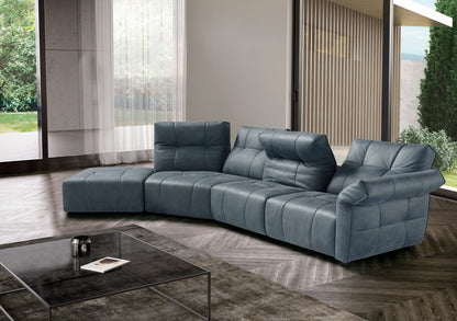 Sospiro modular sofa in blue-grey leather with square quilting and adjustable backrests in a bright modern living room